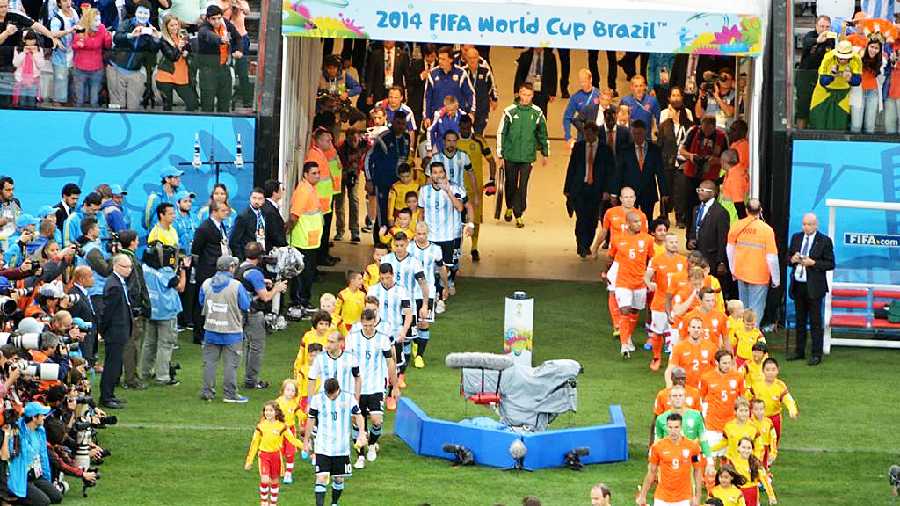 Netherlands and Argentina players enter the ground during the semi-final of the 2014 Fifa World Cup in Brazil