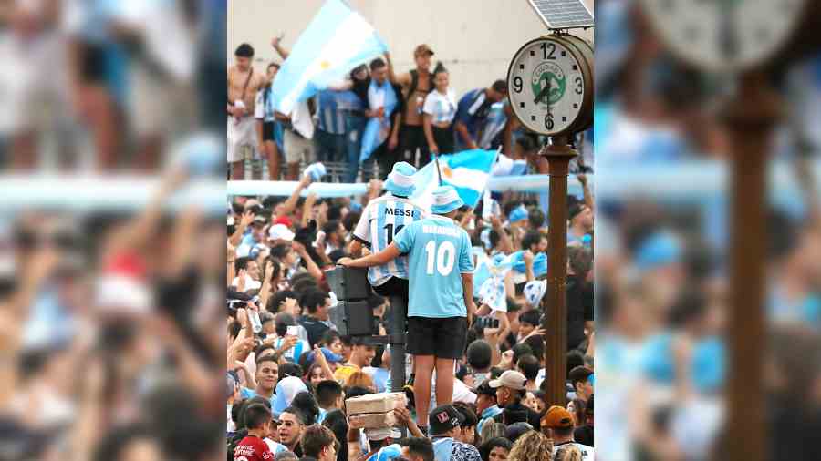 Fans celebrate in Buenos Aires on Tuesday after Argentina won their semi-final against Croatia to advance to Sunday’s World Cup fina