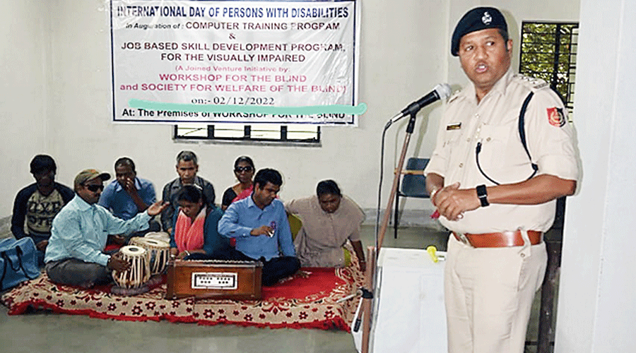 Surajit Dey, assistant commissioner of police, airport zone, delivers a speech.