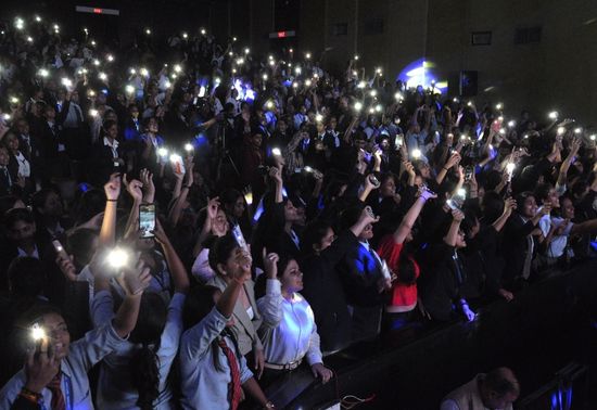 The audience turned on the flashlights during one of the performances of Legacy Fest at Kala Mandir