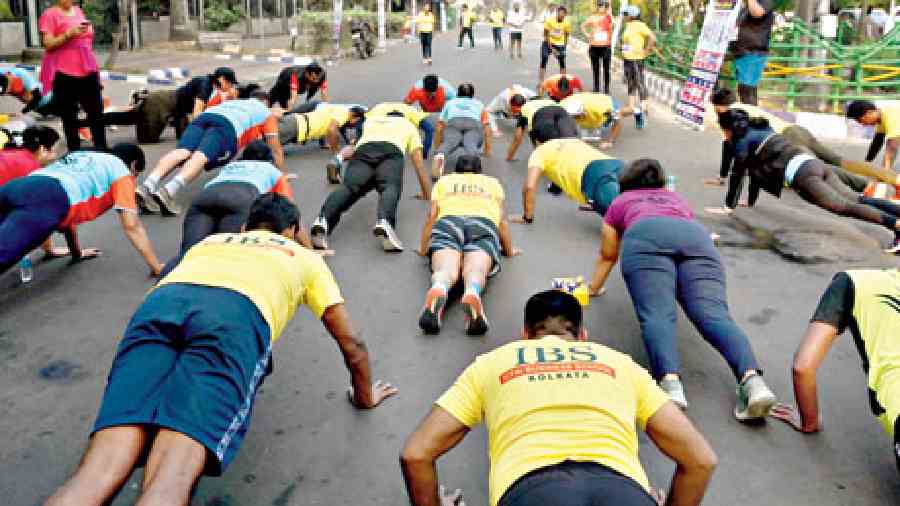 Participants did some warm-up exercises before the marathon.