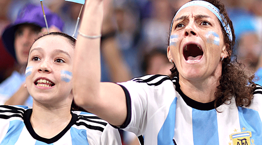 A couple of Argentina fans cheer the team on during the tournament.