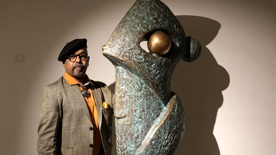 The artist with a bronze sculpture titled ‘The Balance’