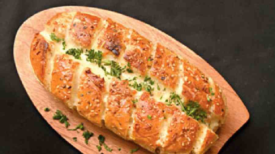 Bread Mix: A signature dish, the cheese pull in this soft, fluffy and buttery garlic infused bread is amazing. (Rs 290)