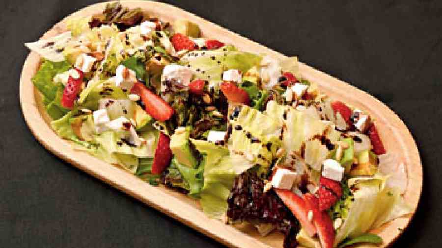 Strawberry Avo- cado Salad: The  slight tang of the strawberry along with the creamy avocado makes for a perfect mix  in this deliciously refreshing  salad. (Rs 320)