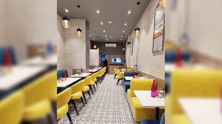 With classic black-and-white mosaic flooring and elegant cylindrical lights that hang from the ceiling, its neat interiors offer a relaxed ambience that is perfect for a quick meal.