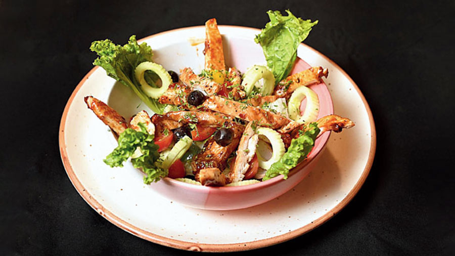 BBQ Chicken Salad: Fresh veggies with spicy chicken strips, this bowl of goodness is healthy and filling. Rs 215