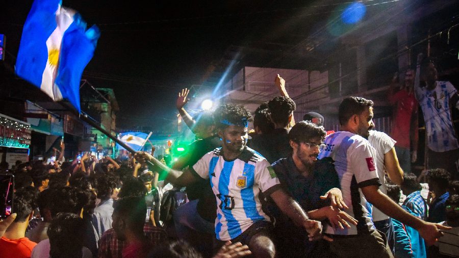 Fans in Kochi cheering on with Argentina's national flag. 