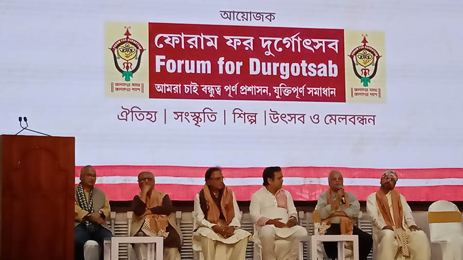 Dignitaries on stage at Swikritir Utsob organised by Kolkata's Forum at Town Hall on December 15