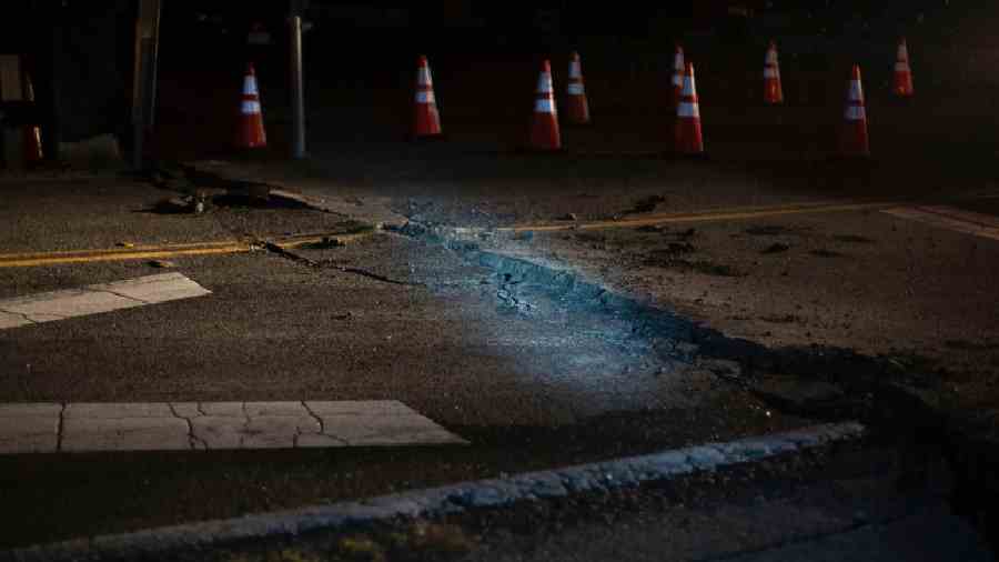Damage is seen on California State Route 211 leading to the Ferndale bridge after an earthquake near Ferndale, California.