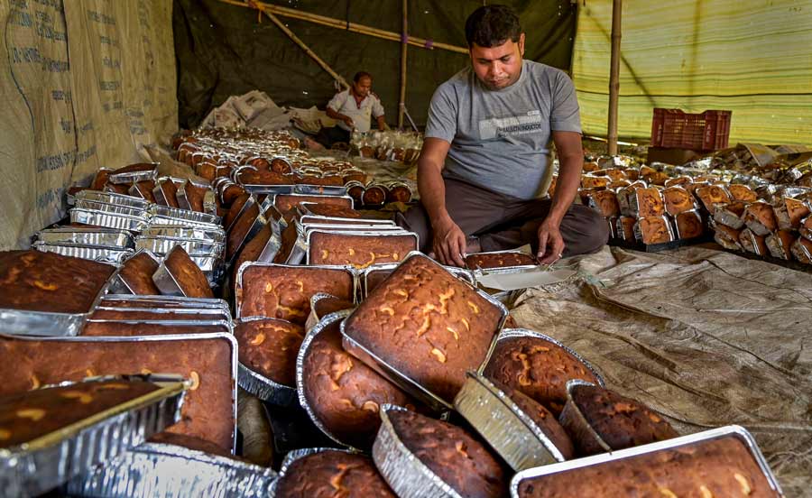 A worker packs cakes at a workshop in Nadia on Wednesday