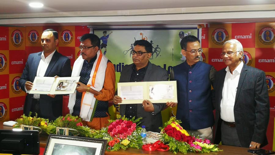 Gopal Bose's son Aurijit (extreme left) and Post Master General of Kolkata Anil Kumar (centre) at the releasing of a special first-day cover on the late Bengal cricketer