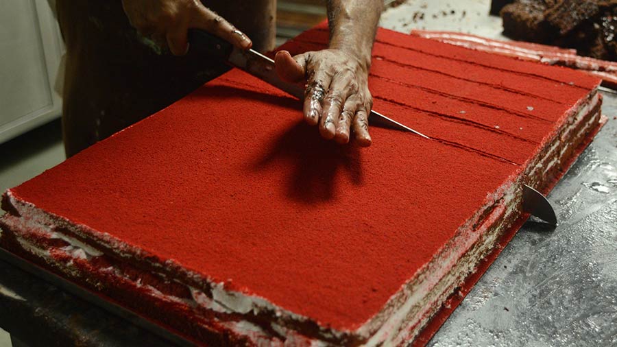 Red velvet pastries in the making at Flury’s