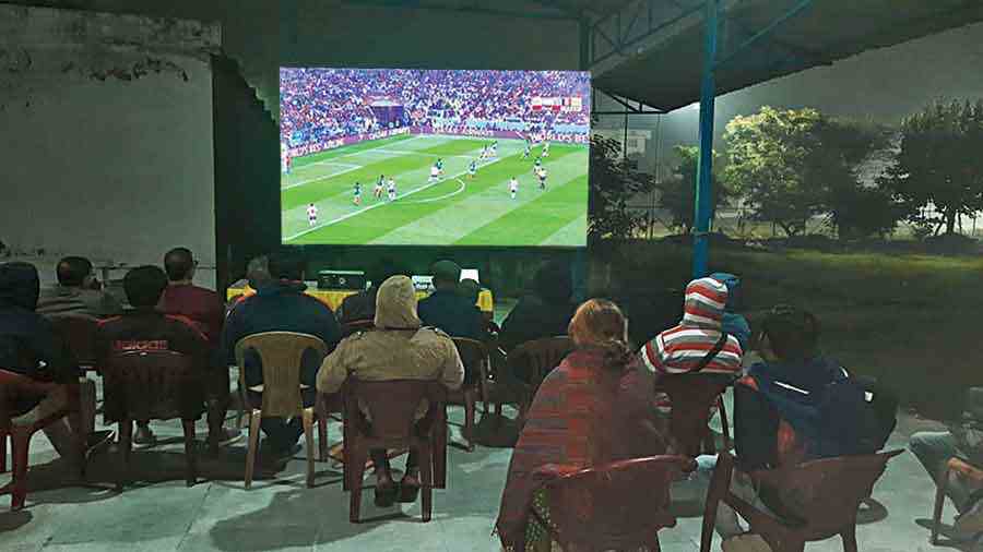 Residents of CE Block, New Town, watch the World Cup final at their activity centre on Sunday. 