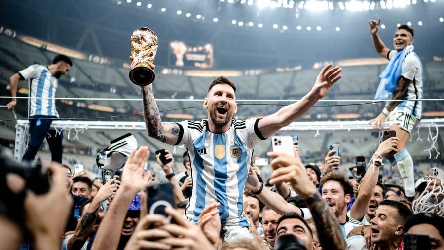 Lionel Messi celebrating Argentina’s World Cup victory in Qatar with his teammates and fans