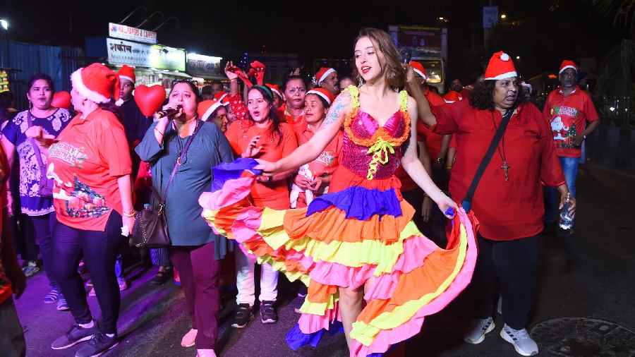 People take part in a Christmas carnival, in Mumbai. 