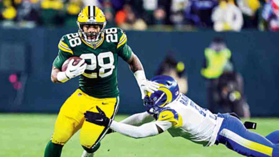 File picture of Green Bay Packers running back AJ Dillon is tackled after a catch by Los Angeles Rams cornerback Jalen Ramsey