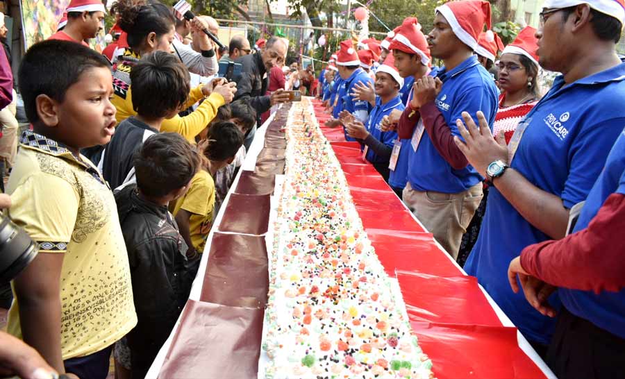 A 50-foot-long cake was prepared at Jagat Mukherjee Park, north Kolkata, on Saturday. The cake was distributed among children with special needs and children of pavement dwellers