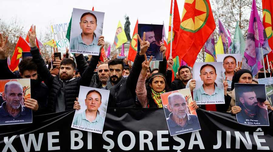 Members of the Kurdish community gathered at the Place de la Republique square with photos of victims and flags of the Kurdistan's Workers Party (PKK) group	
