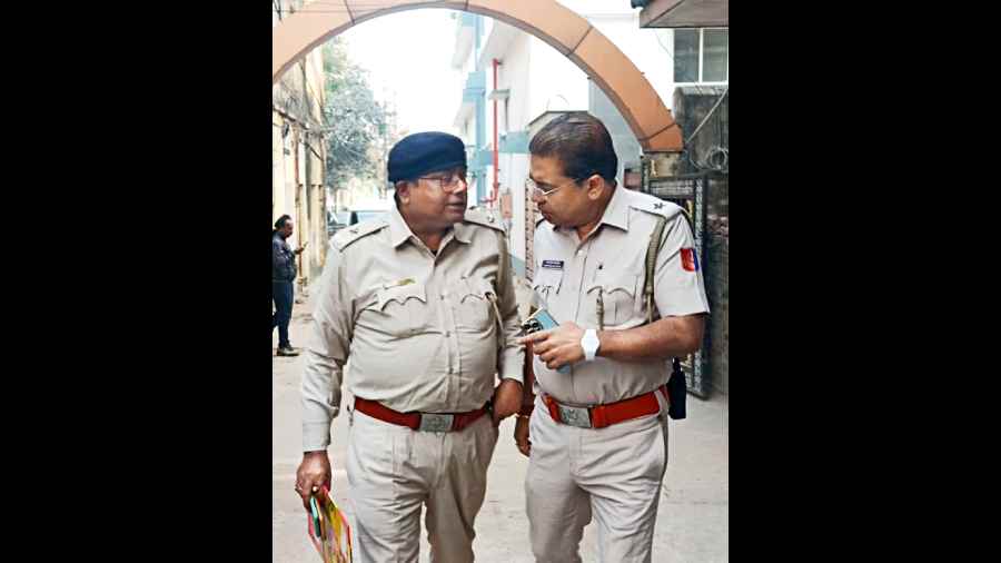 Police officers coming out of the residence of BJP leader Chaitali Tiwari in West Burdwan’s Asansol on Saturday