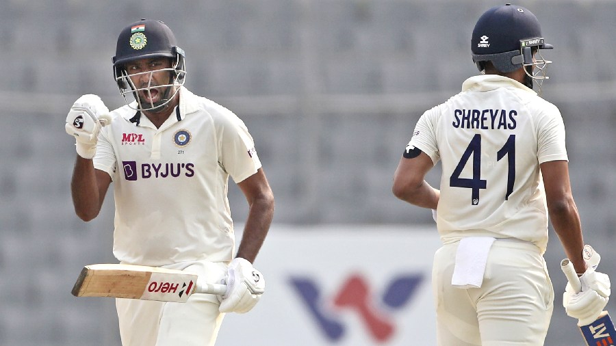 India's Ravichandran Ashwin, left, and Shreyas Iyer celebrates after scoring the final run to beat Bangladesh on the fourth day of the second cricket test match, in Dhaka, Bangladesh, Sunday, December 25, 2022. 
