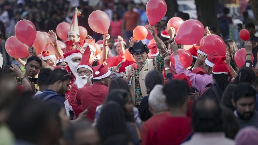 People celebrate Christmas at Marine Drive in Mumbai. 