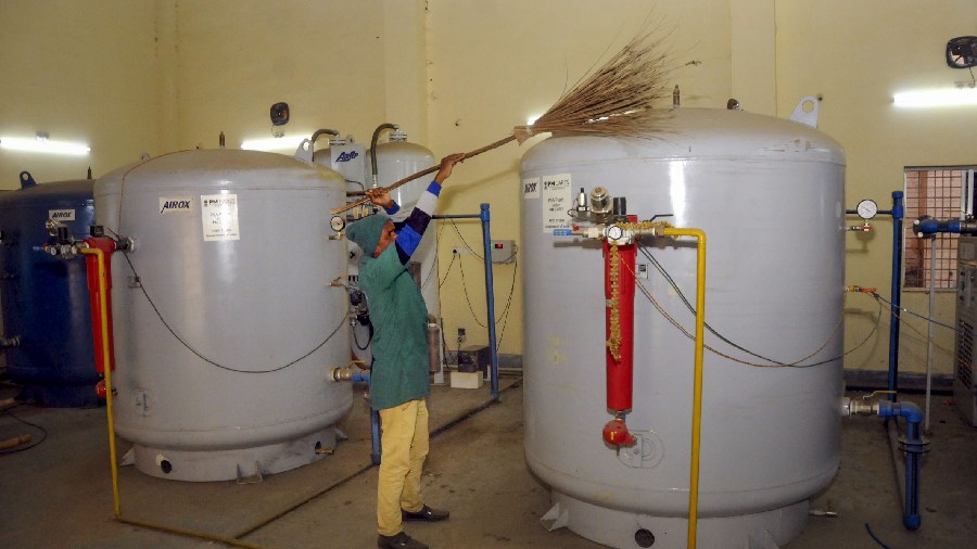 A worker cleans the PSA (Pressure Swing Adsorption) at RIMS, in Ranchi. 