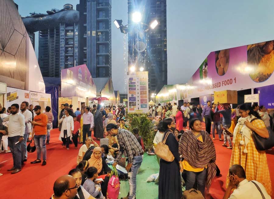 People visit the 21st International Mega Trade Fair at Science City on Monday evening. The fair, which will continue till January 2, has witnessed the participation of over 20 foreign countries and almost all Indian states