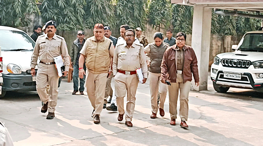 Police arrive at the residence of BJP councillor Chaitali Tiwari in Asansol on Monday.