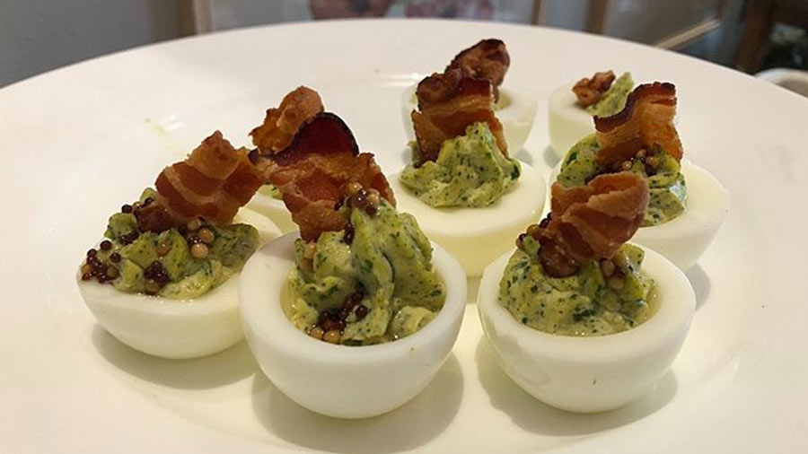Devil’s eggs with mustard green and bacon filling
