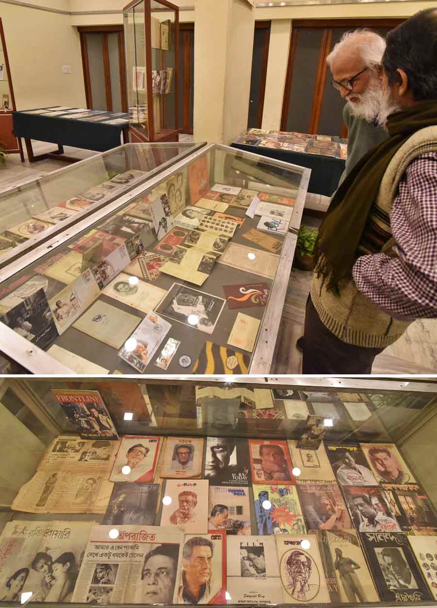 Visitors check out exhibits on display at the birth centenary celebration of Satyajit Ray at Gorky Sadan on Tuesday