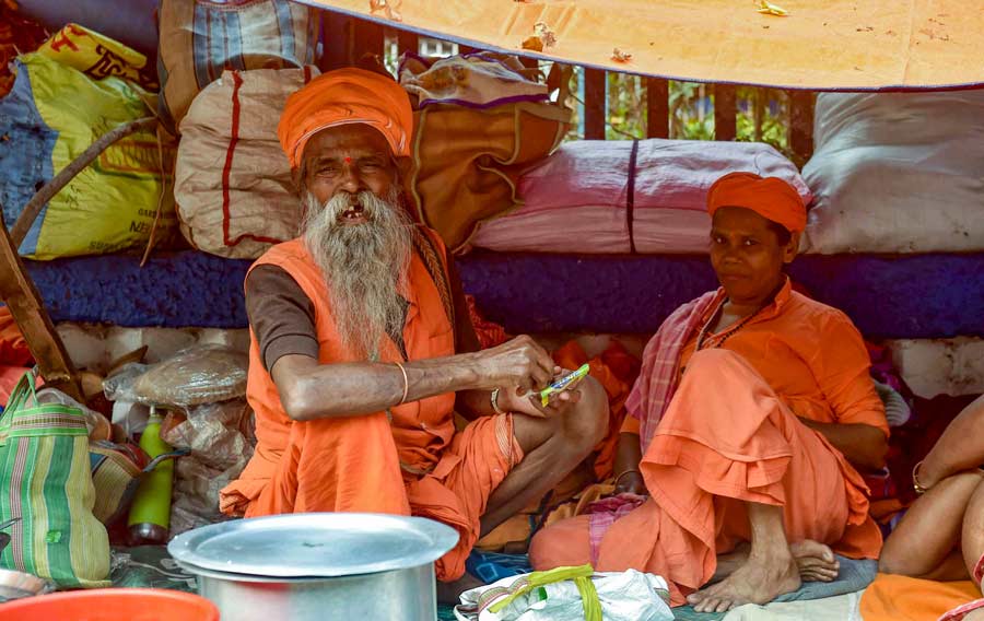 Sadhus on their way to Gangasagar Mela rest at Babughat in Kolkata on Tuesday