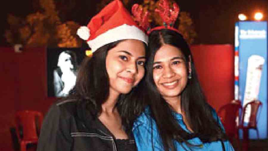 With the usual December chill missing, smart comfy co-ords and short skirts were common trends spotted at the club. Sisters Rishieka and Deetyaa Ray chose their smart casuals from Zara. “Christmas means a lot of relaxation, a lot of family time and lots of music,” said Rishieka (right), a lawyer and Deetyaa, a student.