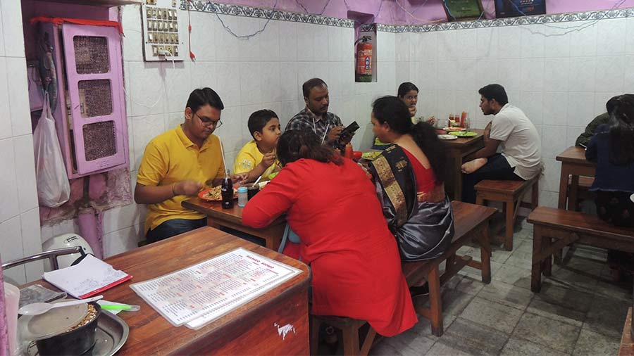 People enjoy the food inside Hamro Momo