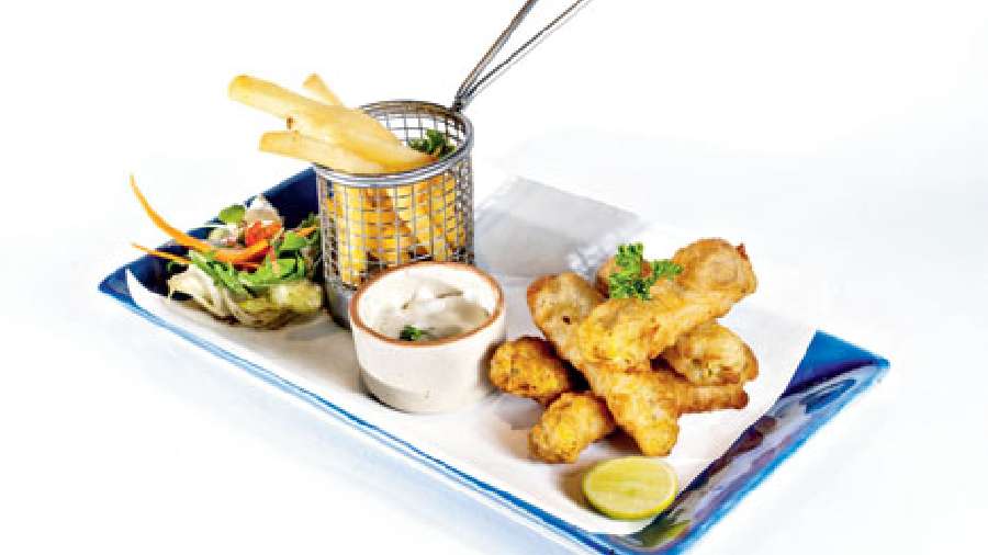 Beer Batter Fish: Basa fish finger fried in beer batter, served with tartare sauce. A perfect starter for all your cocktails. The fish is juicy and tender, with a crisp outer coating.