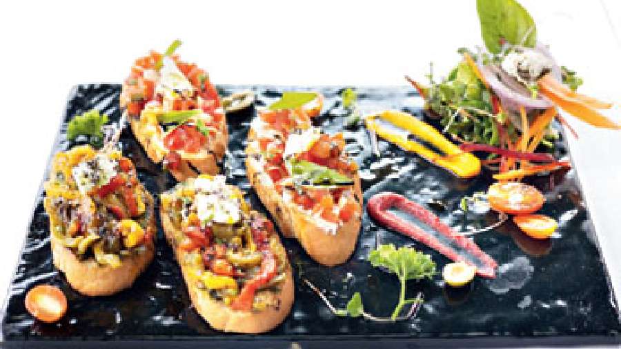 Bruschetta: Herbed, rubbed, grilled bread with flavourful toppings and mixed greens. A great sharing plate.