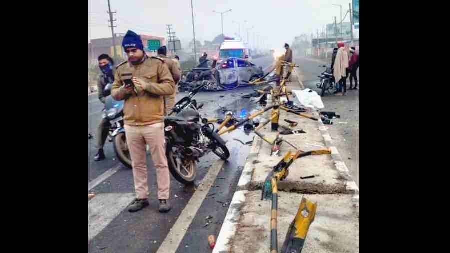 The mangled road divider at the crash site.