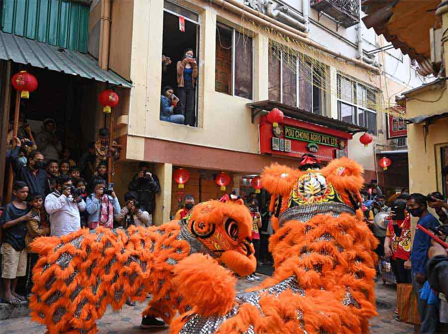 Residents, onlookers and visitors to Tiretti Bazar gather to witness the Dance of the Lions