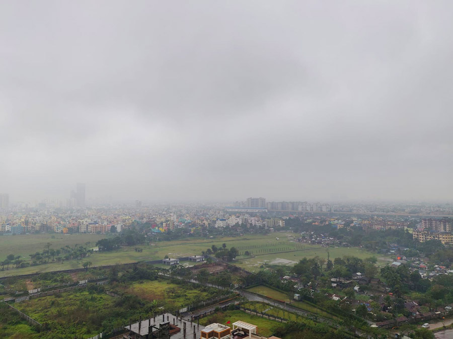 Grey clouds dot the skyline, as seen from a housing complex off the Bypass, near Kasba, on Friday morning. The unseasonal rain is being caused by Western Disturbances, according to the Met office. Kolkata received 23.2mm of rainfall from 8.30am to 11.30am