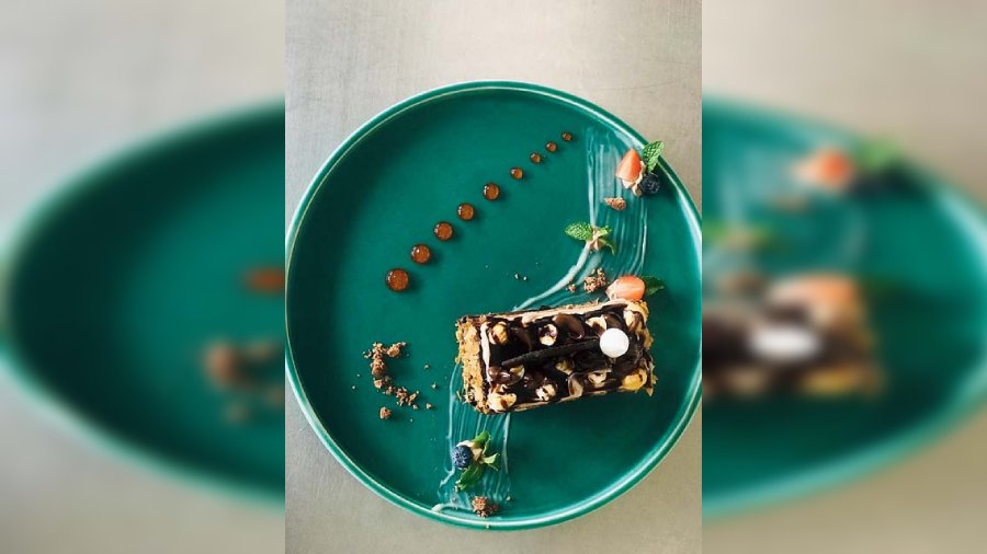 Nutella and Almond Slice at Fenicia Lounge: A simple yet potent cake that houses layers of chocolate ganache and Nutella hazelnut spread in a humble cake, at this Sector V party pad. @Rs 299-plus
