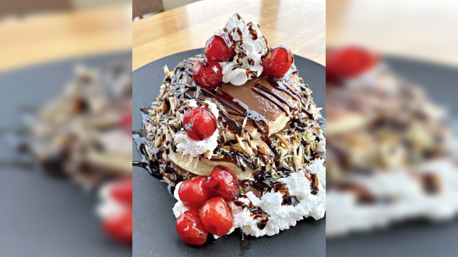 Triple Decker Nutella Pancake at Kava, Fairfield by Marriott Kolkata: Eggs, butter, milk, flour and sugar batter round-shaped flat cakes, stacked in triple layers and topped with Nutella and nuts. An anytime eat at the New Town hotel. @Rs 425-plus
