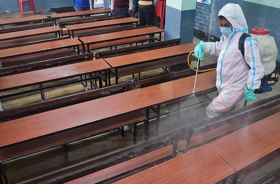 COVID SHIELD: A classroom being sanitised at Jodhpur Park Boys School in south Kolkata on Tuesday, February 1. Schools in Bengal reopened on February 3 for students from classes VIII to XII. Students from classes V to VII will attend classes in open-air facilities from February 7 as part of the “Paray Sikshalay” initiative