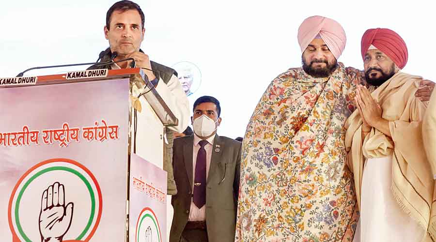 Rahul Gandhi addresses an election rally in Ludhiana on Sunday as Charanjit Singh Channi (extreme right) and Navjot Singh Sidhu look on.