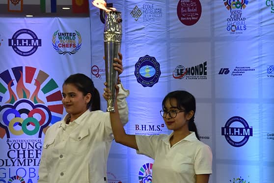 Students of IIHM Kolkata hold up the 'flame of YCO'. 
