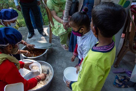 Children were served mid-day meal at Paray Shikshalay.