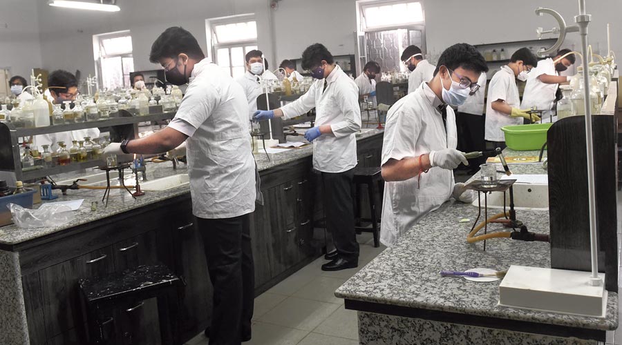 Students of La Martiniere for Boys attend practical classes on Monday. 