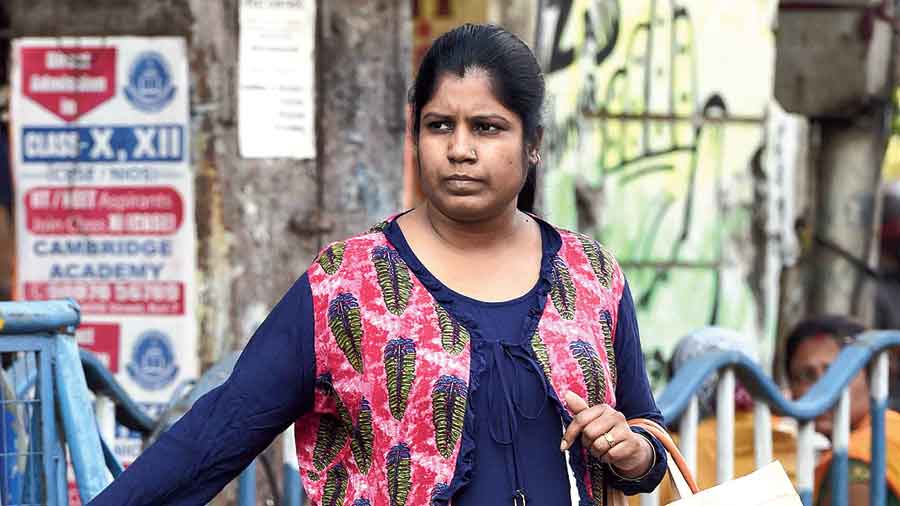 A woman  standing opposite the Calcutta  Medical College and Hospital was without a mask.  “I have the mask in my bag and will wear it before going to a crowded place,”  she said.