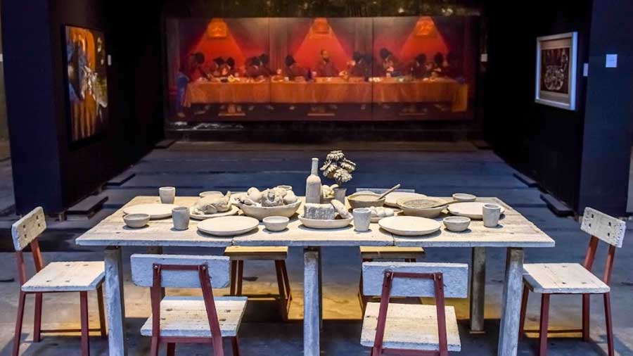 In the foreground, 'Concrete Dinner' (concrete) by CIMA Awards Special Mention winner Sayantan Samanta, displayed at Gem Cinema 