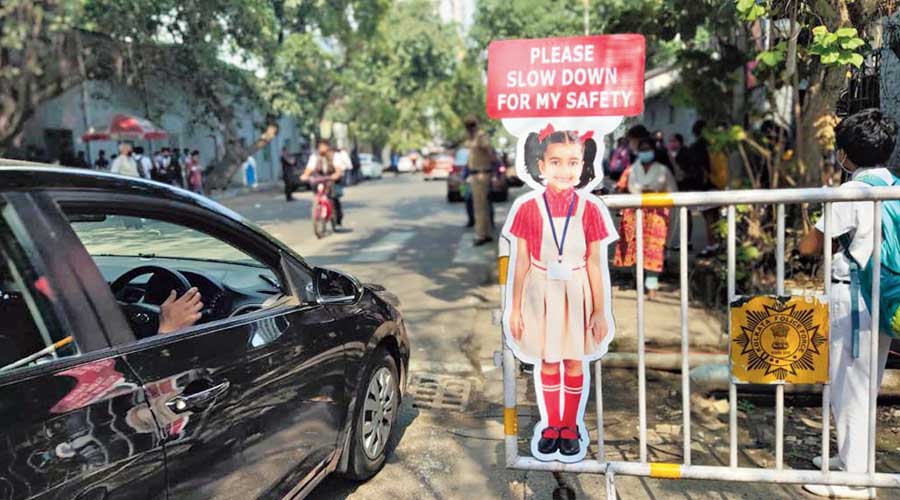 Cutouts of students in uniform installed for road safety awareness