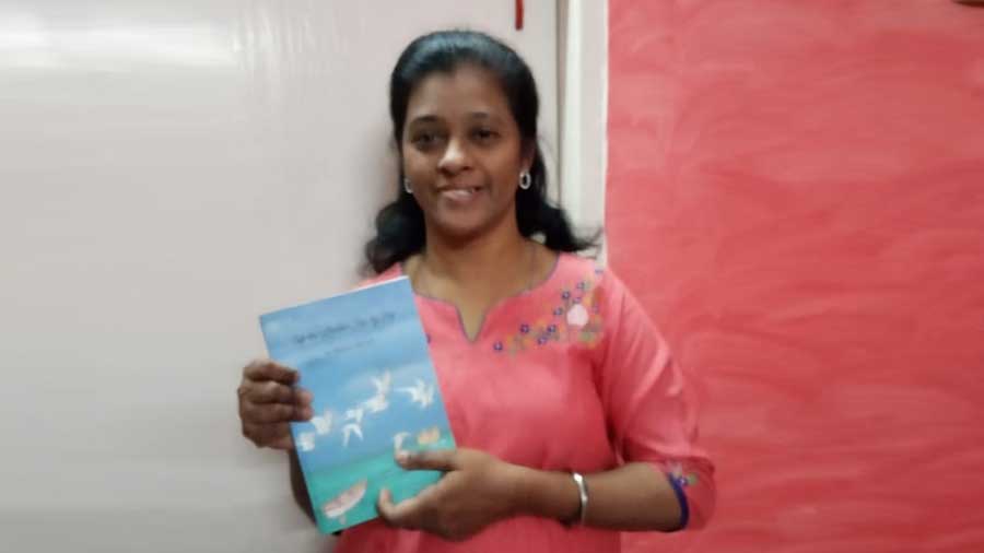 The author holding a copy of the book